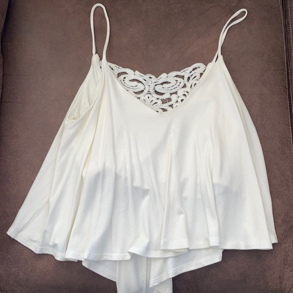 Spaghetti strap cream top with crotchet detailing on the back-size small